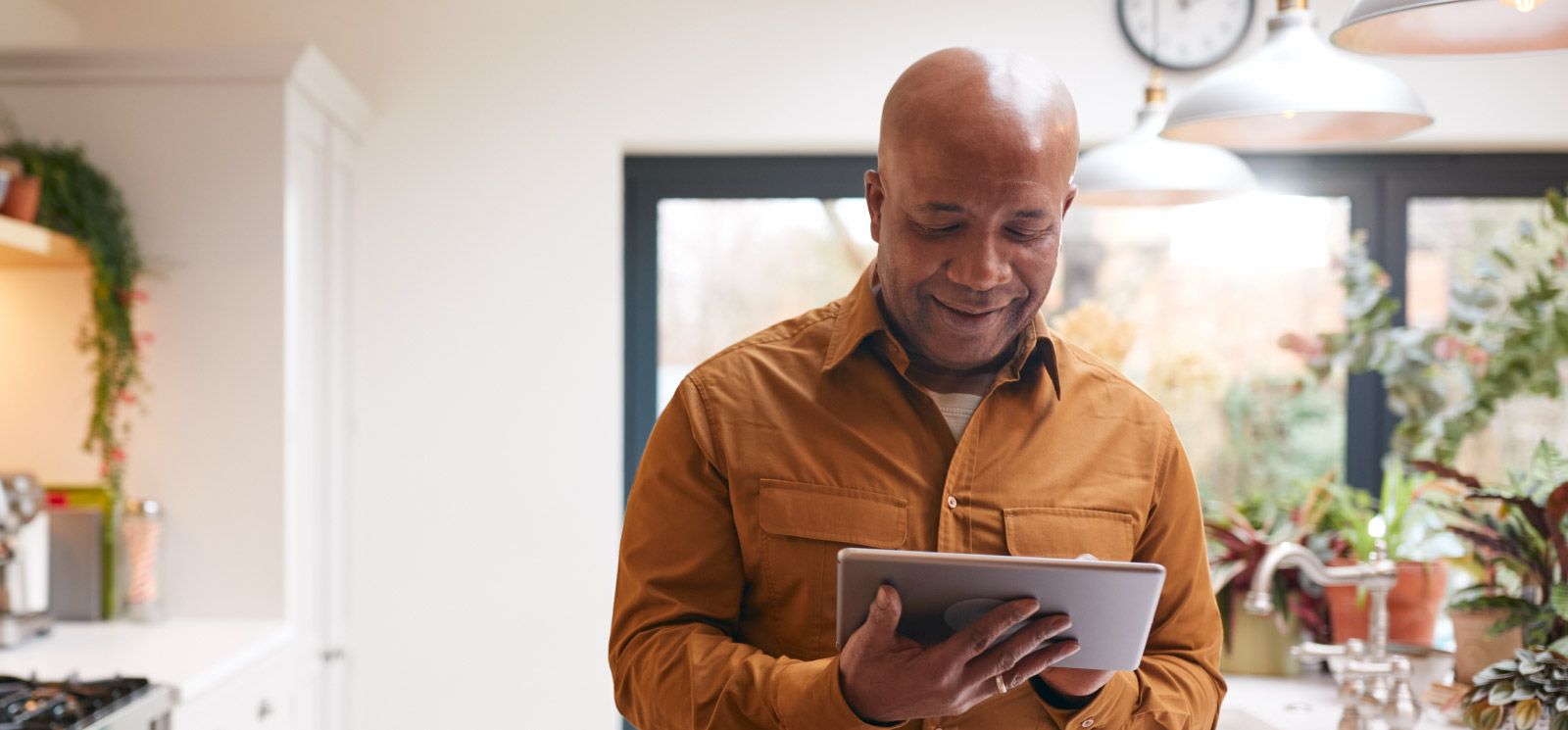 a man viewing his tablet