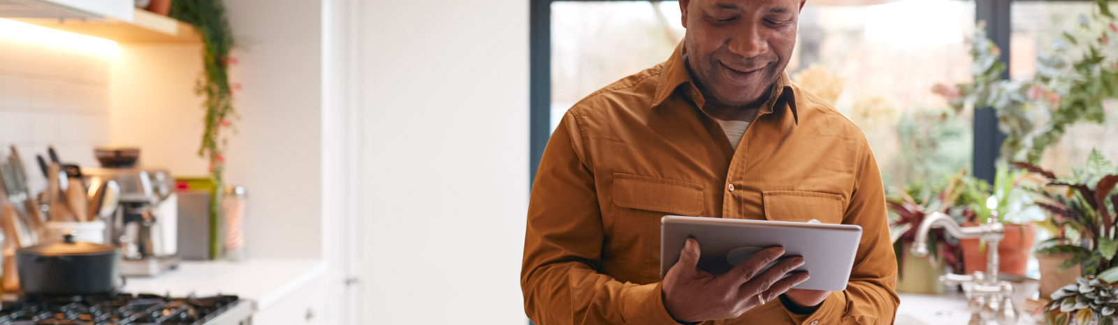 a man viewing his tablet