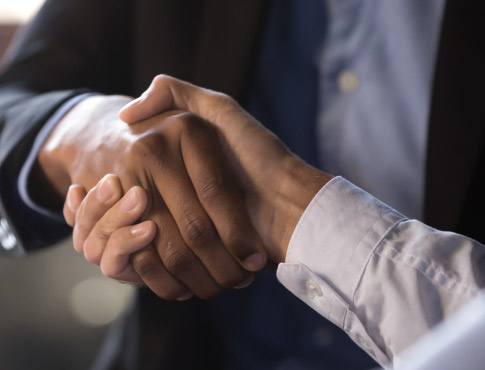 two men engaging in a hand shake